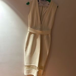 White fitted and sleeveless midi dress with deep V and belt